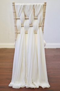 Ivory Chiffon Weave Chair Decoration on a Chiavari Chair