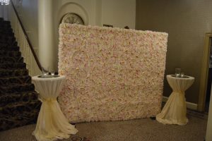 Flower Wall and Aluminium Poseur Tables with Sequin Cloths and Sashes