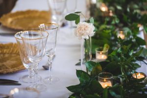 Top Table Decoration with Gold Rimmed Glassware and Gold Floral Leaf Charger Plates