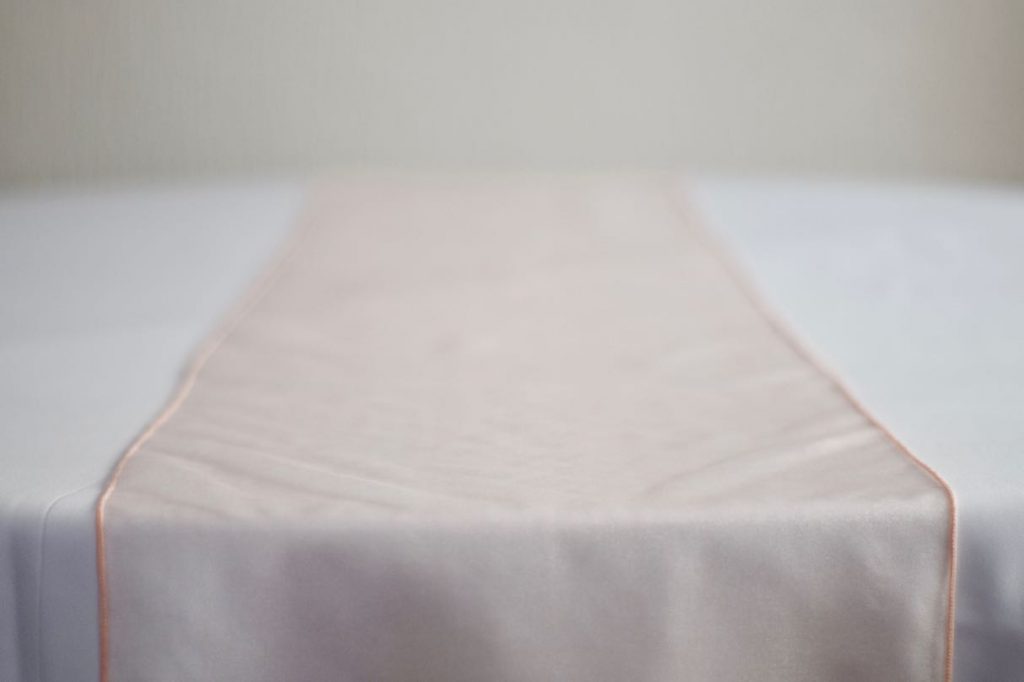 Blush Pink Organza Table Runner on White Table Cloth