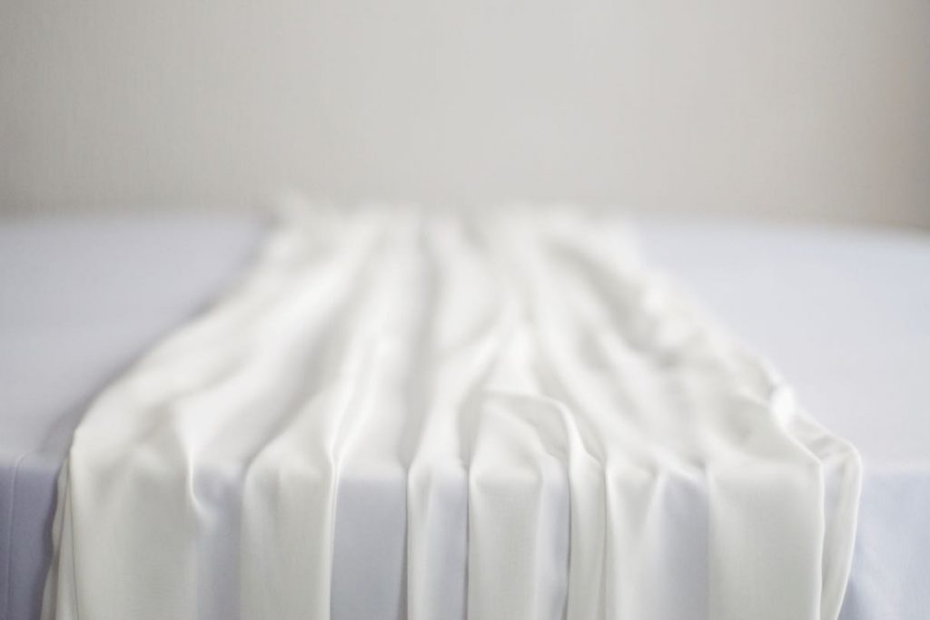 Ivory Chiffon Table Runner on White Table Cloth